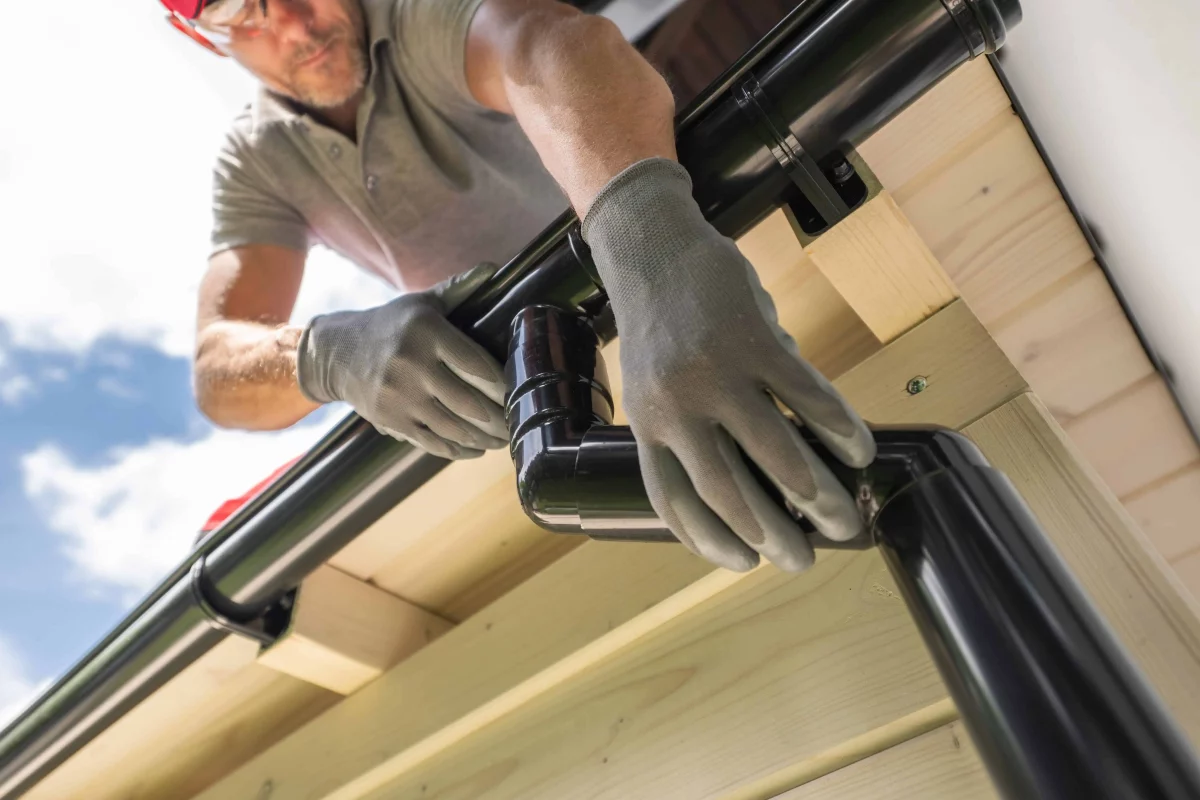New guttering being fitted to a fascia board
